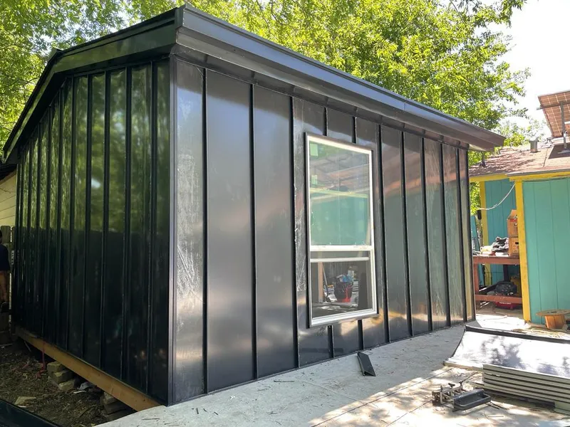 Black standing seam metal wall panels for Roof Inspection in Notre Dame
