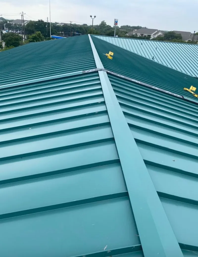 Green commercial metal roof ridge and valley for Metal Roof Repair in Notre Dame