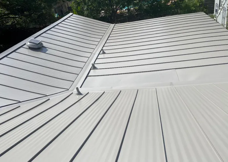 Solar attic fan installed on a metal roof for Roof Ventilation in Notre Dame